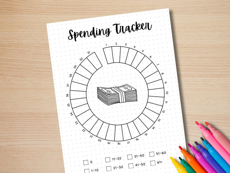 May include: A black and white printable spending tracker with a circle divided into 31 sections. The sections are numbered 1 through 31. There is a stack of money in the centre of the circle. Below the circle are checkboxes labelled 0, 1-10, 11-20, 21-30, 31-40, 41-50, 51-60, and 61+.