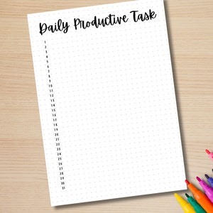 May include: A white sheet of paper with a dotted pattern and the text "Daily Productive Task" at the top. The numbers 1 through 31 are listed down the left side of the page.