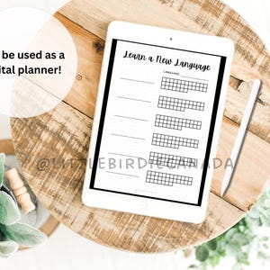 May include: A digital planner template on a tablet screen with the text "Learn a New Language". The template has a section for the language name and a grid for tracking progress.