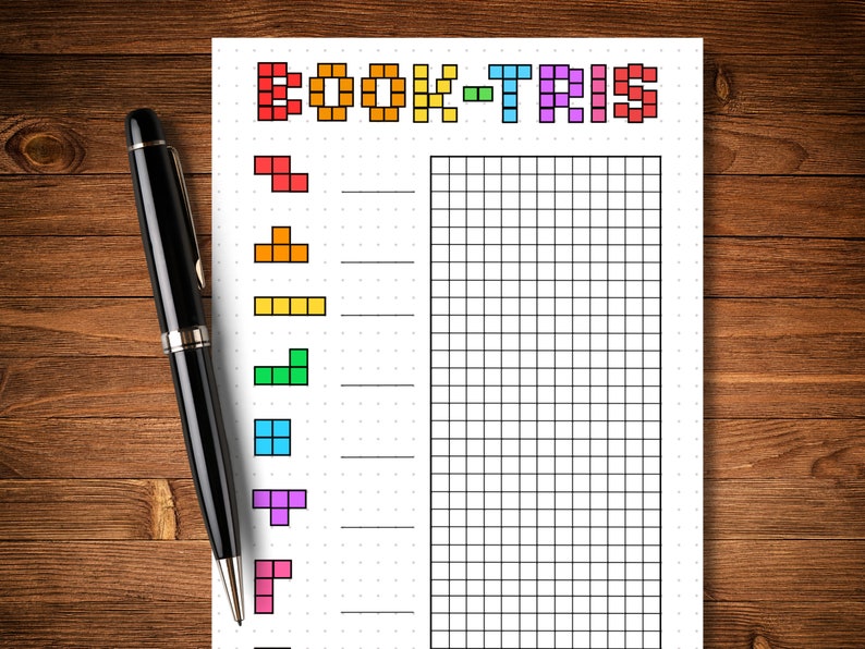 May include: Printable book tracker with a Tetris theme. The title "Book-Tris" is written in pixelated letters. The page features a grid for tracking books read and a column of Tetris blocks in various colors.