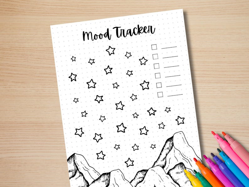 May include: A printable mood tracker featuring a mountain and star design. The tracker has a dotted background and a checklist with lines for writing.