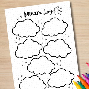 May include: A white Dream Log journal page with a dotted grid, featuring cloud outlines for recording dreams. The page includes the text "Dream Log" with a moon and star graphic. Colorful markers are visible in the corner.
