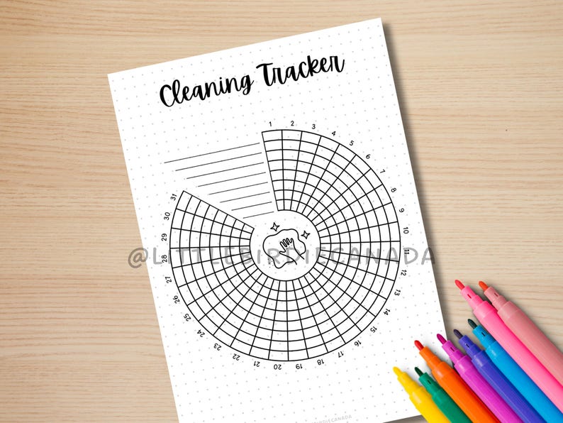 May include: A black and white printable cleaning tracker with a circle divided into 31 sections. The center of the circle features a hand with a sponge and two stars. The title "Cleaning Tracker" is at the top of the page.