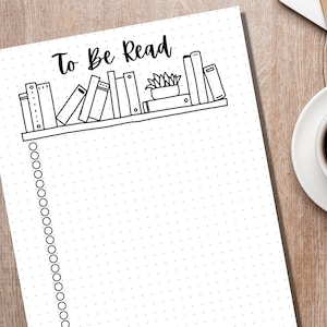 May include: A white printable to-do list with a black and white illustration of a bookshelf with books and a potted plant. The text "To Be Read" is at the top of the page. The list has a dotted line down the left side.
