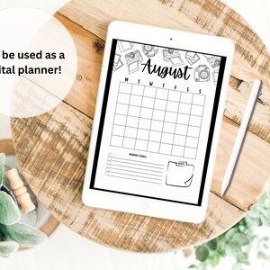 May include: A digital planner template for the month of August with a black and white camera border. The planner includes a calendar grid, a section for monthly goals, and a notes section.