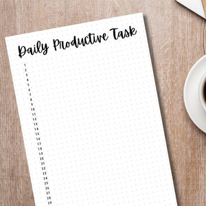 May include: A white sheet of paper with the text "Daily Productive Task" at the top. The paper is numbered from 1 to 29 and has a dotted pattern.