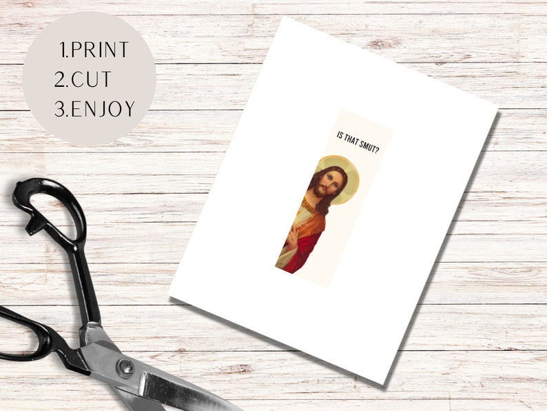 May include: A white card with the text "IS THAT SMUT?" printed on it. A picture of Jesus is peeking out from behind the card.