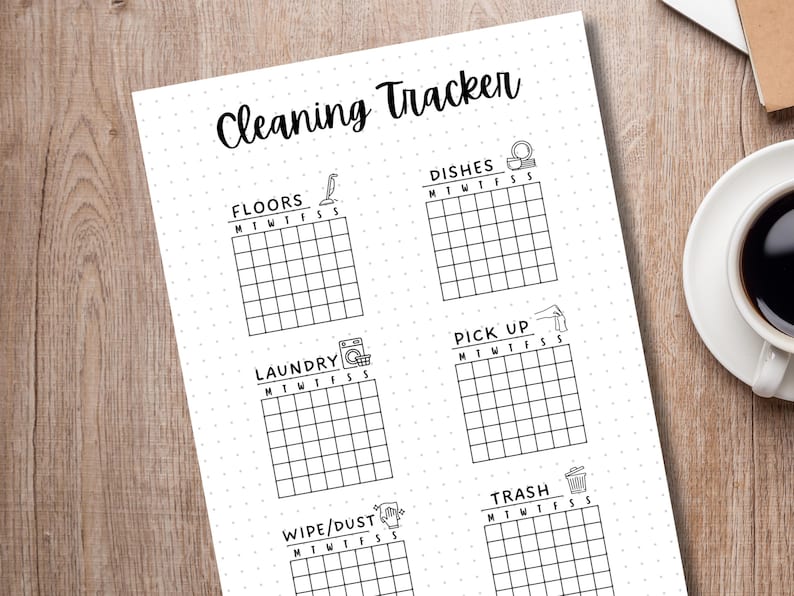 May include: A printable cleaning tracker checklist with a black and white design. The checklist includes tasks such as floors, dishes, laundry, pick up, wipe/dust, and trash. Each task has a corresponding icon and a grid for marking off days of the week.