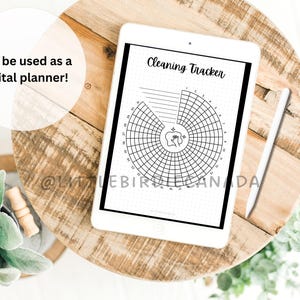 May include: A black and white printable cleaning tracker on a digital tablet. The tracker is a circle divided into sections with numbers 1-31. The text "Cleaning Tracker" is at the top of the page.