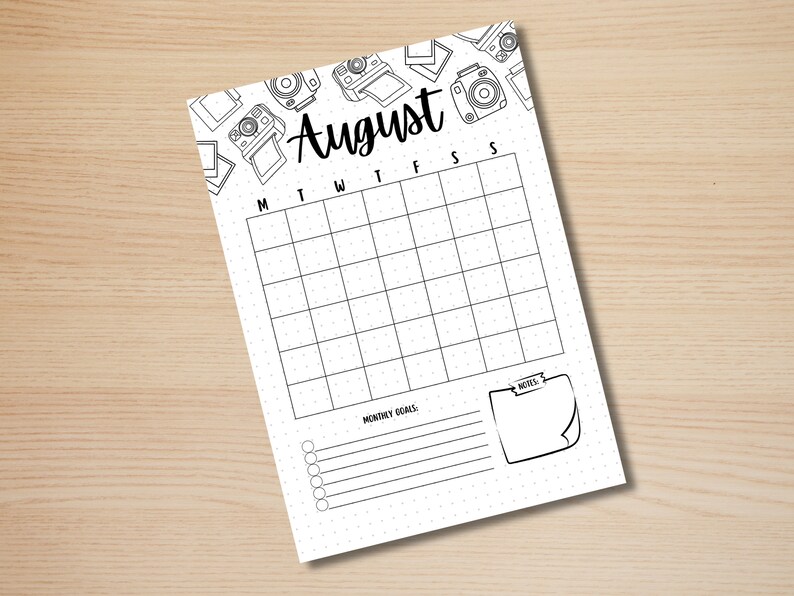 May include: A printable August calendar with a dotted grid and a section for monthly goals and notes. The calendar is decorated with a border of hand-drawn cameras.