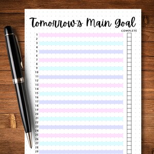 May include: A printable to-do list with the title "Tomorrow's Main Goal" and a column for marking tasks as complete. The list has 29 numbered lines with alternating pastel pink, blue, and purple stripes.
