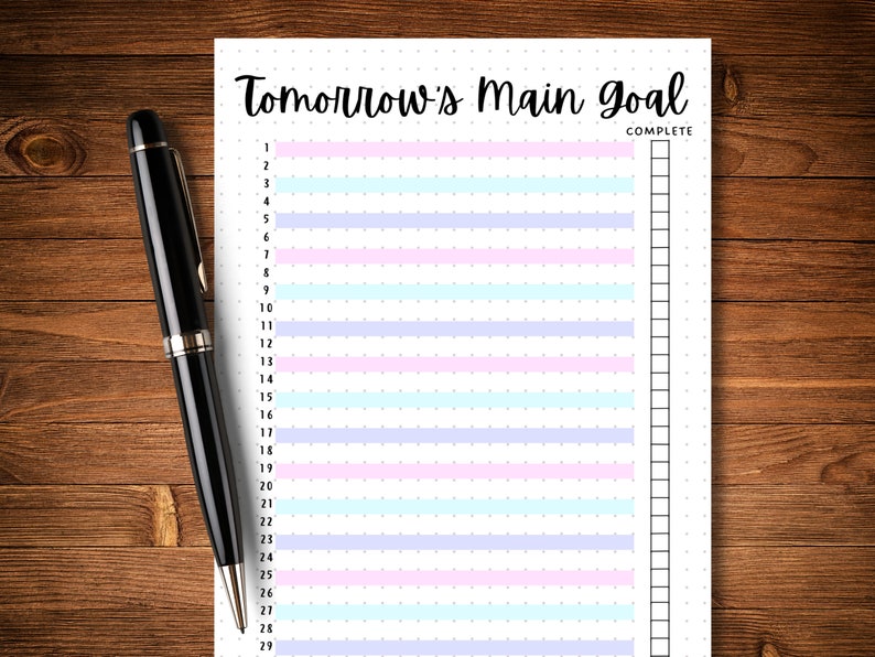 May include: A printable to-do list with the title "Tomorrow's Main Goal" and a column for marking tasks as complete. The list has 29 numbered lines with alternating pastel pink, blue, and purple stripes.