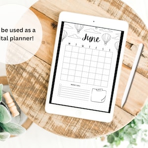 May include: A black and white digital planner on a tablet with a June calendar, hot air balloons, and clouds. The planner has space for monthly goals and notes.