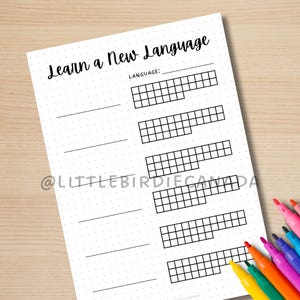 May include: Printable worksheet with the text "Learn a New Language" and a section to write the language name. The worksheet has a dotted background and five rows of blank squares for tracking progress.