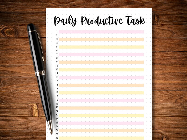 May include: A printable daily productive task list with numbered lines and alternating pink and yellow stripes. The list is on a white sheet of paper with a dotted background.