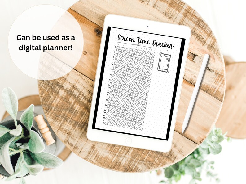 May include: A black and white digital planner on a wooden table with a stylus. The planner has a grid of circles and the text "Screen Time Tracker".