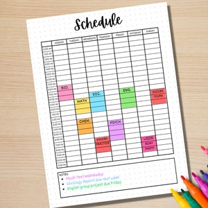 May include: A weekly schedule planner with a black and white grid and colorful boxes for each day of the week. The boxes are labeled with times from 8:00 AM to 5:00 PM. The planner also includes a notes section with bullet points listing "Psych Test Wednesday", "Sociology Report due next week", and "English group project due Friday".