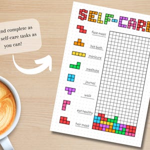 May include: A self-care checklist with the word "SELF-CARE" in pixelated letters. The checklist includes tasks like "face mask," "hot bath," and "meditate." A coffee cup with latte art sits on a wooden surface.