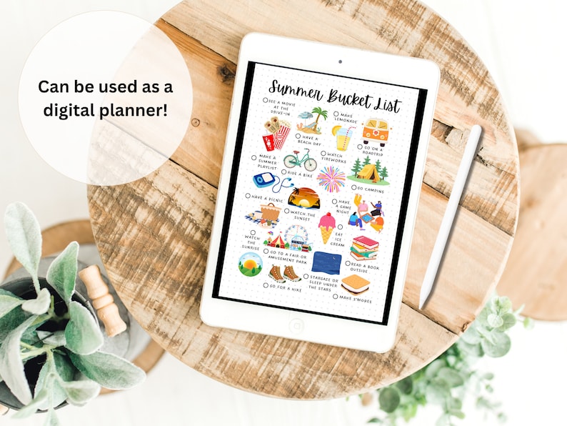 May include: A digital planner on a tablet with a summer bucket list. The list includes activities like making lemonade, having a beach day, watching fireworks, going camping, and making s'mores.
