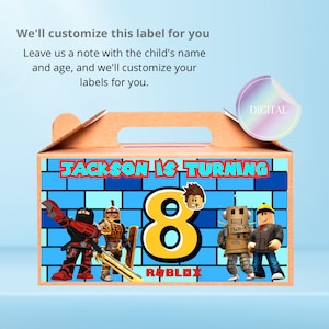 May include: A brown cardboard box with a handle, decorated with a blue and white brick pattern. The box has a label that says "JACKSON IS TURNING 8" with a yellow number 8 and the word "ROBLOX". The label also features images of Roblox characters, including a red and black ninja, a knight in armor, a robot, and a builder.