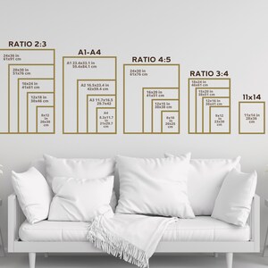 May include: A white sofa with white cushions in front of a white wall with a chart showing different ratios and sizes of prints in inches and centimetres. The chart is labelled "Ratio 2:3", "A1-A4", "Ratio 4:5", "Ratio 3:4", and "11x14".