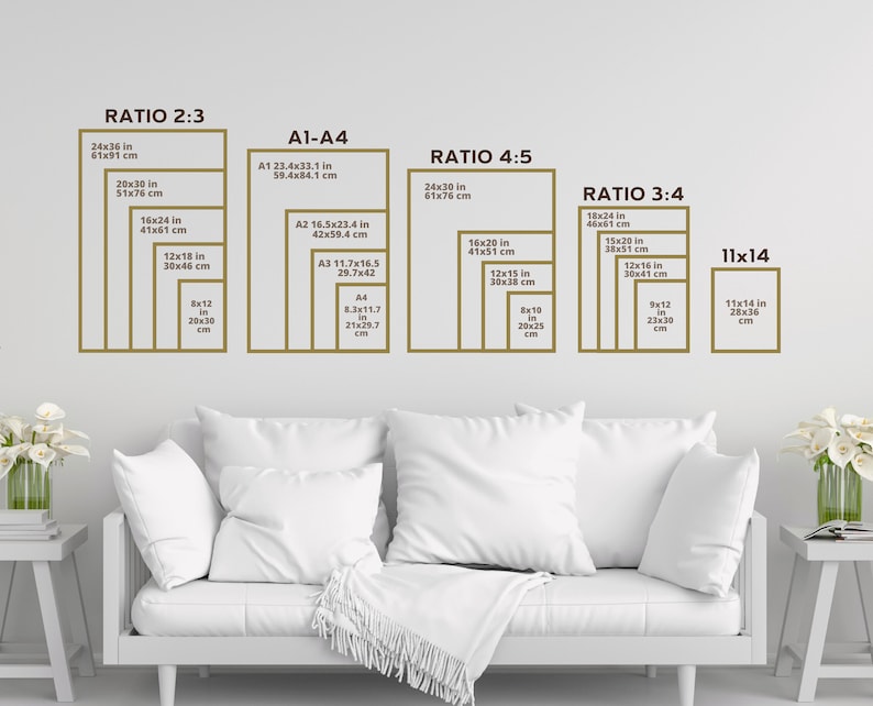 May include: A white sofa with white cushions in front of a white wall with a chart showing different ratios and sizes of prints in inches and centimetres. The chart is labelled "Ratio 2:3", "A1-A4", "Ratio 4:5", "Ratio 3:4", and "11x14".
