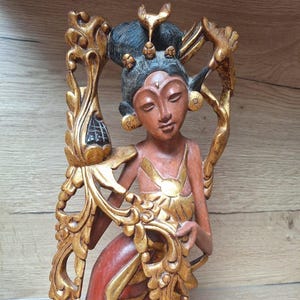 Sculpture of a Janger dancer in carved wood from Bali, Balinese craftsmanship, Indonesia.