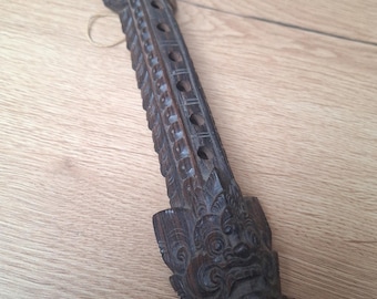 Vintage wooden duduk musical instrument, Balinese flute carved from wood, Bali, Indonesia
