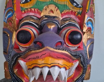 Balinese Barong mask in carved wood, Indonesia, traditional hand-carved crafts. Bali