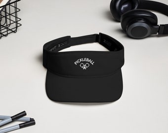 May include: Black visor with a white embroidered pickleball logo and the text "Pickleball" above it.