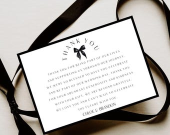 May include: A white card with a black border and a black ribbon. The card says "THANK YOU" at the top, with a bow graphic. The card includes a thank you message and the names "Chloe & Brandon".