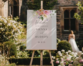 Peut inclure: Un panneau de bienvenue de mariage rectangulaire sur un chevalet en bois avec un arrangement floral aquarelle en haut dans des tons de rose, jaune et vert. Le texte indique Welcome TO THE WEDDING OF SIENNA and HUDSON 06.21.2X sur fond rose pâle.