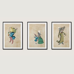 May include: Three framed illustrations of anthropomorphic animals wearing clothing and hats. The first illustration features a green frog wearing a blue jacket and a top hat. The second illustration features a blue crayfish wearing a green dress and a white hat. The third illustration features a green alligator wearing a brown coat and a top hat.