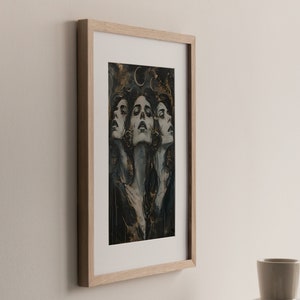 May include: A framed print of a woman's face with a gold and black background. The woman's face is repeated three times, each with a slightly different angle. The background features a crescent moon and gold accents.