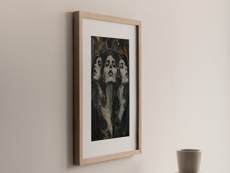 May include: A framed print of a woman's face with a gold and black background. The woman's face is repeated three times, each with a slightly different angle. The background features a crescent moon and gold accents.