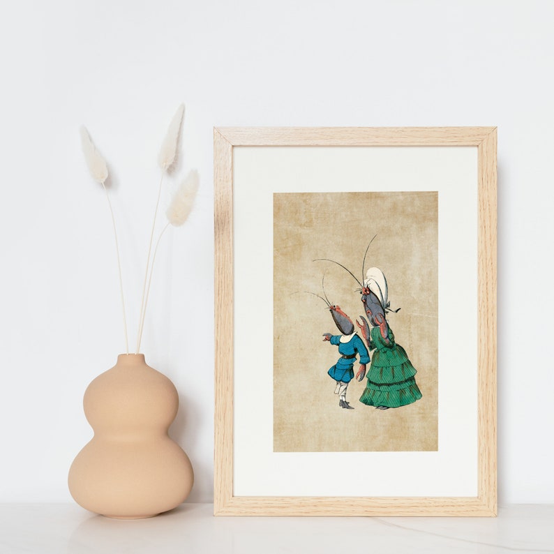 May include: A framed print of a vintage illustration featuring two anthropomorphic lobsters dressed in clothing. The lobster on the left is wearing a blue jacket and pants, while the lobster on the right is wearing a green dress and a white hat.