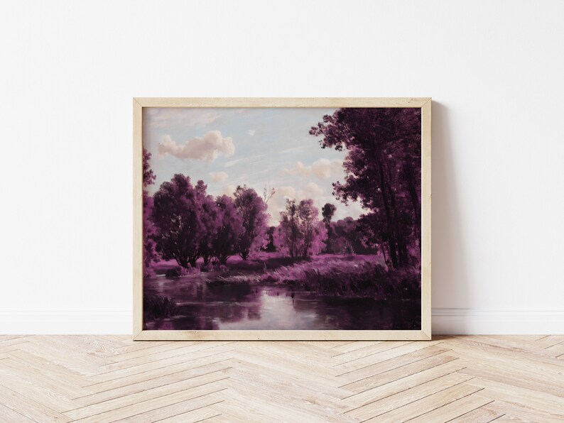 May include: A framed landscape painting of a river flowing through a forest. The trees are a vibrant purple color, and the sky is a soft blue with white clouds. The painting is set against a white wall.