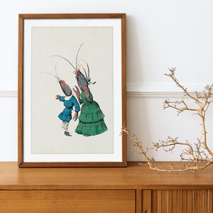 May include: A framed illustration of two anthropomorphic lobsters dressed in 19th-century clothing. The lobster on the left is wearing a blue jacket and white pants, while the lobster on the right is wearing a green dress and a white bonnet.