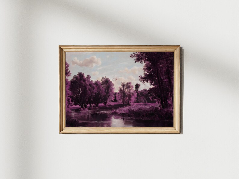 May include: A framed painting of a landscape with a river and trees in shades of purple. The sky is a light blue with white clouds.