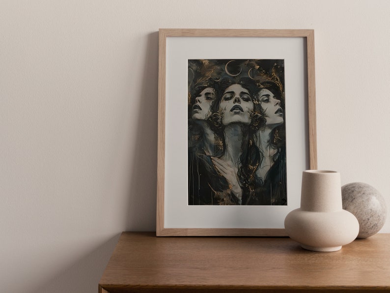 May include: A framed print of a woman's face with a dark background and gold accents. The woman's face is repeated three times, each with a slightly different expression. The print is in a light wood frame.