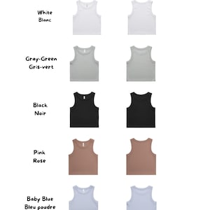 May include: Image showcasing a variety of crop tank tops in different colors. The colors include white, gray-green, black, pink, and baby blue. The text at the top reads "COLORS FOR THE CROP TANK" and "COULEURS POUR LA CAMISOLE". The Naked Club logo is at the bottom.