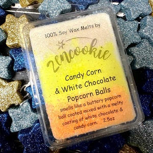 May include: A 2.5 ounce soy wax melt in a clear plastic container. The wax is a yellow and orange gradient with the text "zencookie" in black script. The text "Candy Corn & White Chocolate Popcorn Balls" is in black text. The text "smells like a buttery popcorn ball coated mixed with a melty coating of white chocolate & candy corn." is in black text.