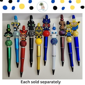May include: Ten colorful pens with different cartoon character toppers. Each pen has a different color and a different character on top. The characters include:  Blossom, Bubbles, Buttercup, Toothless, Bumblebee, Optimus Prime, E.T., Minion, and two Minions.  Each sold separately.