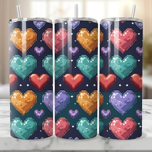 May include: Three stainless steel tumblers with a pixelated heart pattern in shades of orange, red, purple, and teal on a dark blue background.