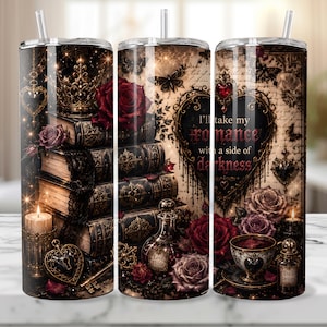 May include: A stainless steel tumbler with a gothic design featuring stacked books, roses, candles, and the text "I'll take my romance with a side of darkness." The design includes a crown, butterflies, and heart-shaped lockets.