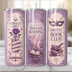 May include: Three purple insulated tumblers with decorative designs and text. One reads "Morally Grey," another "You Had Me At Trigger Warning," and the third "Smutty Book Club." Each features illustrations of flowers, books, and celestial elements.