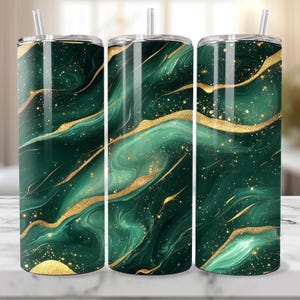 May include: Three stainless steel tumblers with a green and gold marble design. The tumblers have a shiny finish and are perfect for holding hot or cold beverages.