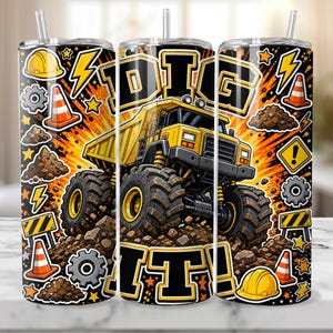 May include: A cylindrical tumbler with a straw featuring a yellow dump truck, construction cones, hard hats, gears, and piles of dirt on an orange and black background. The text DIG IT! is printed in large, bold, black and yellow block letters.