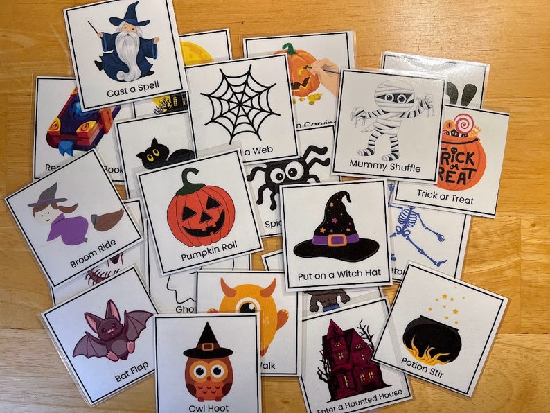 May include: A set of 16 Halloween-themed game cards with colorful illustrations and text. The cards feature activities like "Cast a Spell", "Broom Ride", "Mummy Shuffle", and "Trick or Treat".