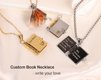 May include: Three gold, silver, and black book necklaces with engraved messages. The gold necklace says "Dear Mama", the silver necklace says "You are the strength for me and kids", and the black necklace says "We love you Forever".